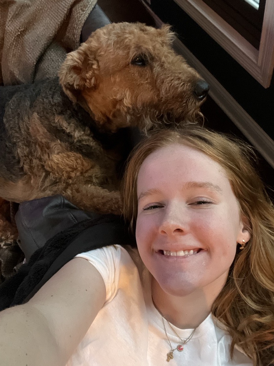 Teagan snuggled up with her dog