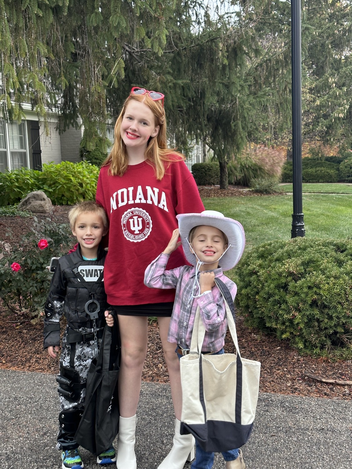 Teagan out with two of the kids she looks after, all dressed up